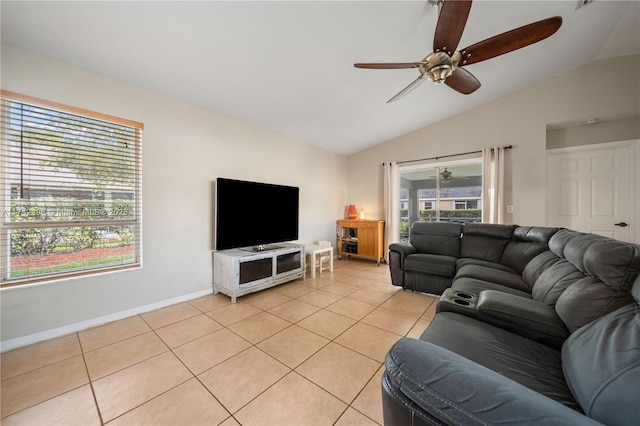 living room with light tile patterned flooring, ceiling fan, and lofted ceiling