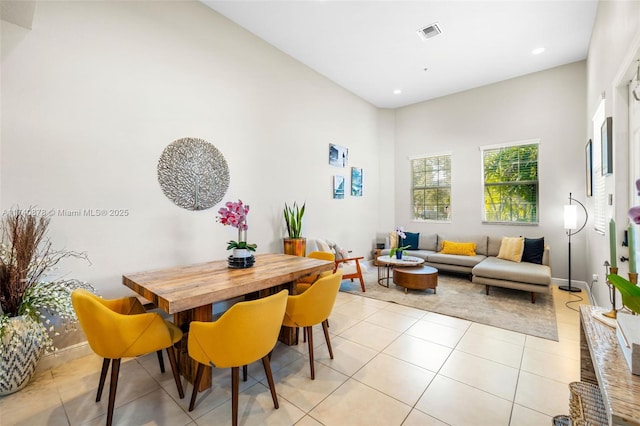 dining space with light tile patterned floors