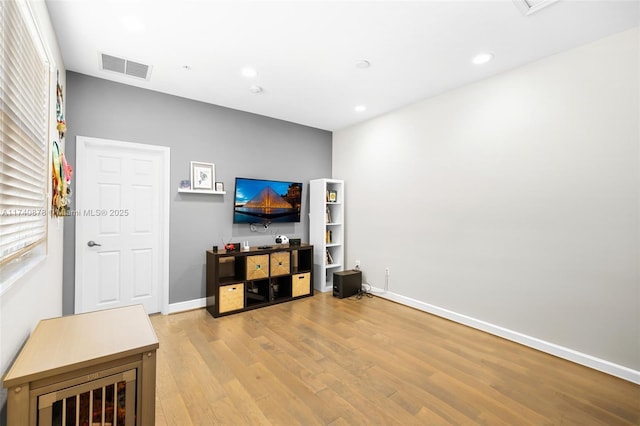 living room with light hardwood / wood-style flooring