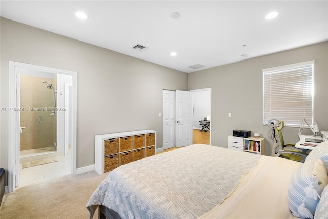 carpeted bedroom with connected bathroom