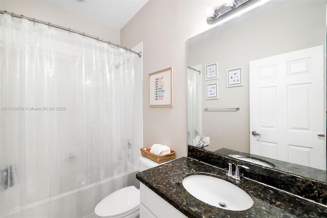 full bathroom featuring toilet, vanity, and shower / bath combo with shower curtain