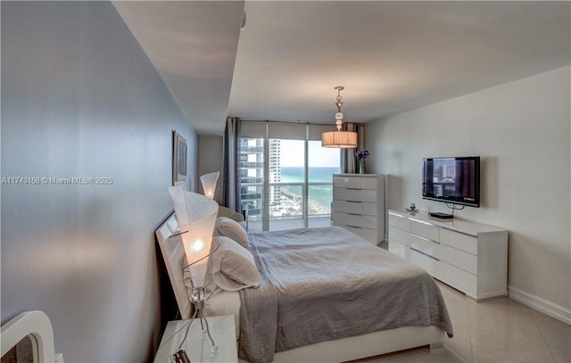 tiled bedroom with expansive windows