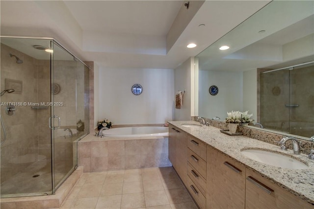 bathroom featuring tile patterned floors, separate shower and tub, and vanity