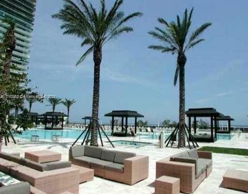 view of pool with an outdoor living space and a patio