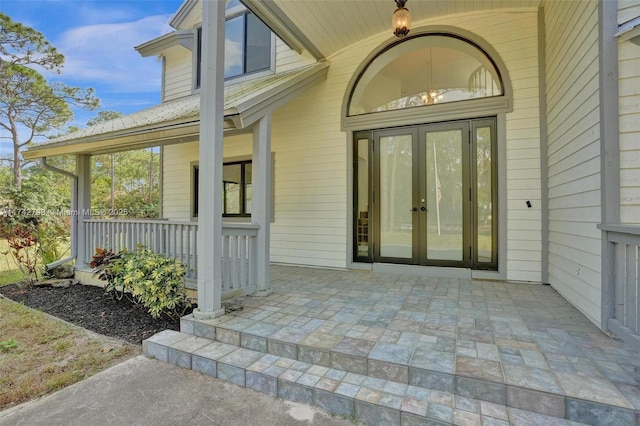 view of exterior entry featuring french doors