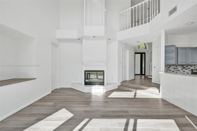 unfurnished living room with hardwood / wood-style flooring