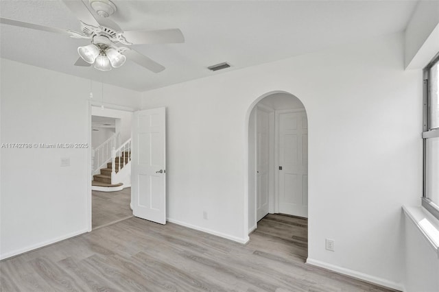 empty room featuring light hardwood / wood-style flooring and ceiling fan