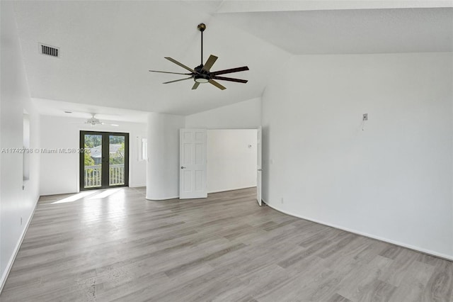 unfurnished room featuring high vaulted ceiling, french doors, ceiling fan, and light wood-type flooring