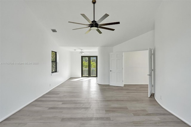 unfurnished room featuring ceiling fan, high vaulted ceiling, and light hardwood / wood-style floors