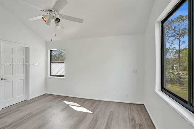 unfurnished bedroom featuring vaulted ceiling, ceiling fan, and light hardwood / wood-style floors