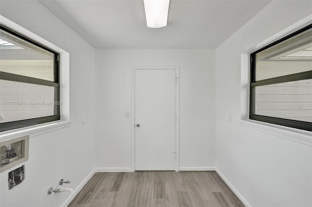 spare room featuring light hardwood / wood-style flooring