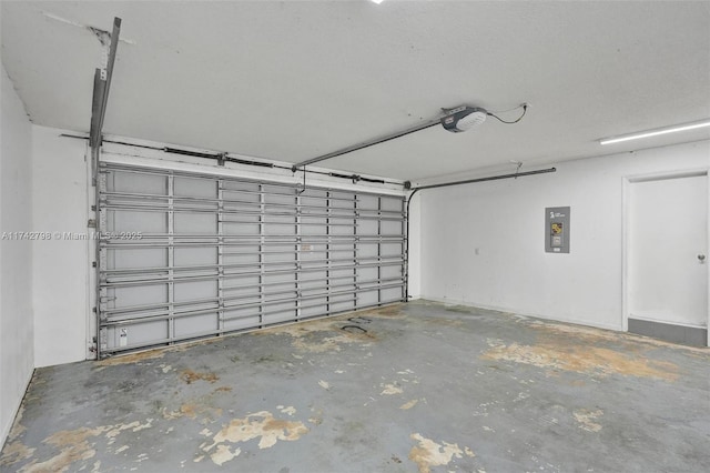 garage with a garage door opener and electric panel