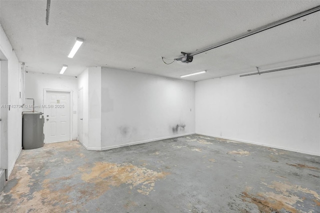 garage featuring a garage door opener and water heater