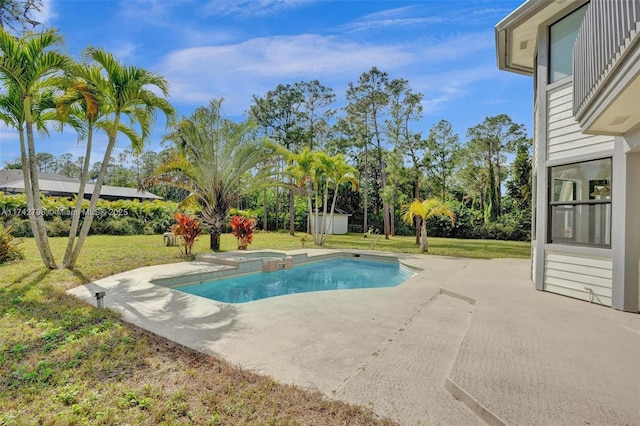 view of swimming pool with a yard and a patio