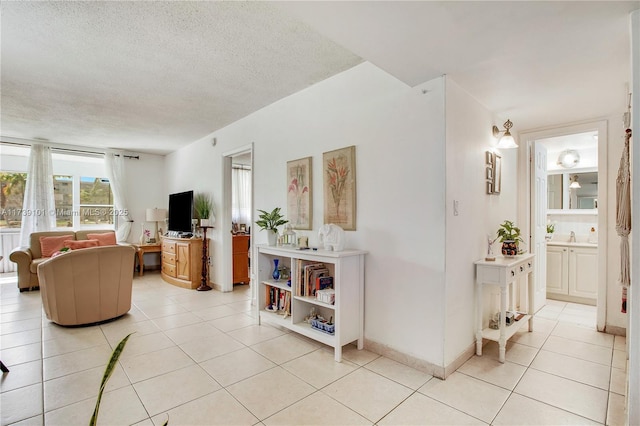 tiled living room with a textured ceiling