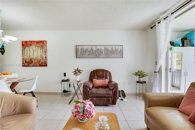 tiled living room featuring a textured ceiling