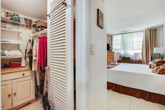 bedroom featuring light tile patterned floors