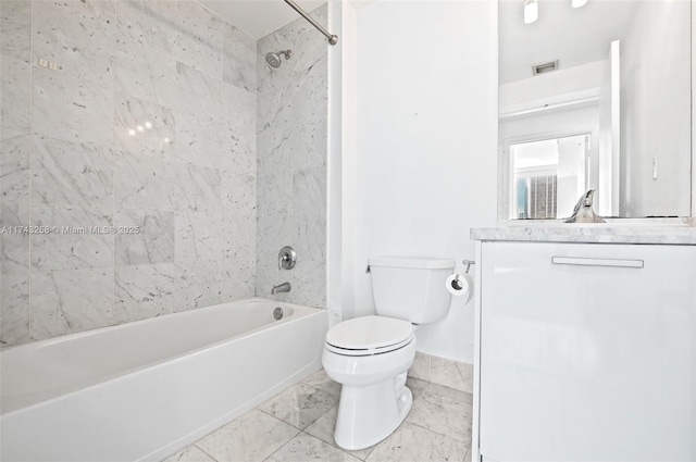 full bathroom featuring toilet, vanity, and tiled shower / bath