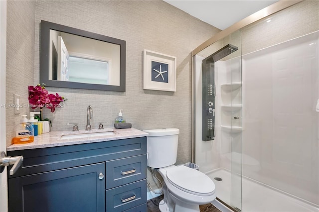 full bathroom featuring decorative backsplash, a shower stall, toilet, and vanity