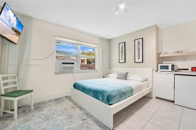 bedroom with light tile patterned floors, baseboards, and cooling unit