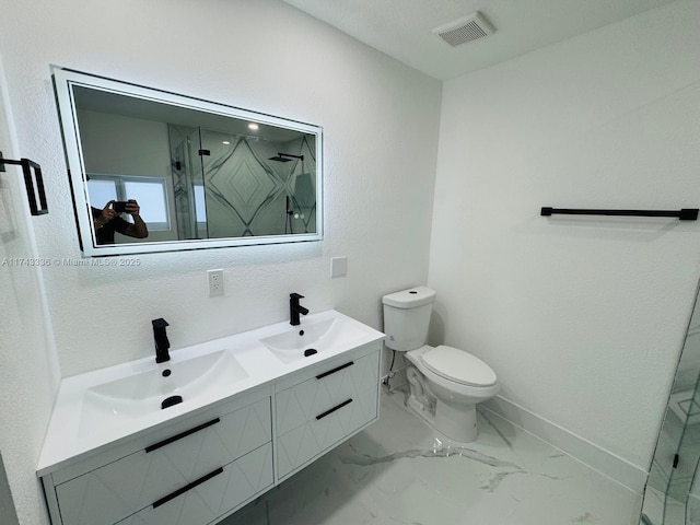 bathroom with vanity, an enclosed shower, and toilet