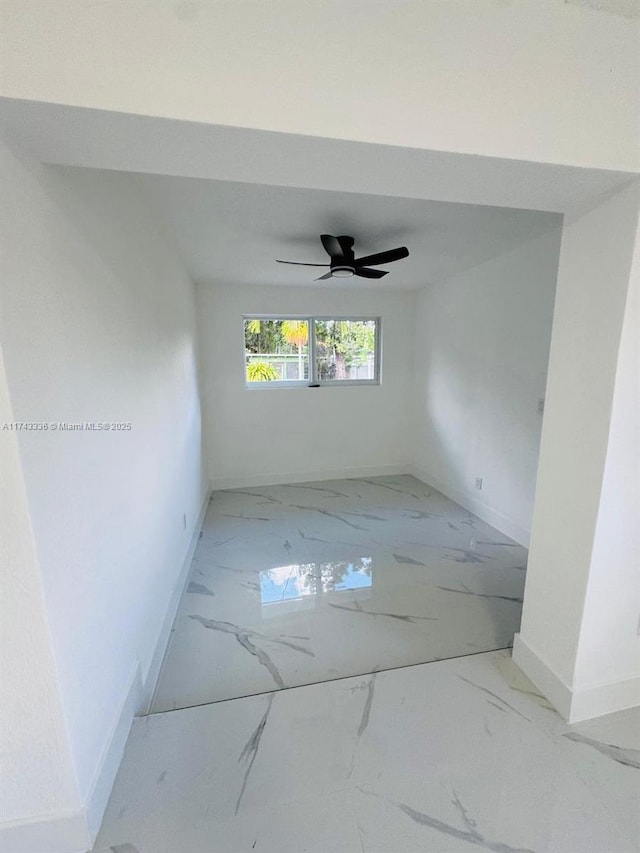 unfurnished room with ceiling fan