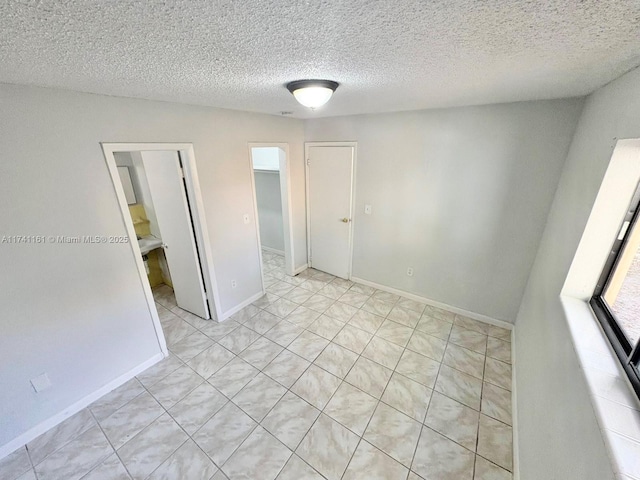 empty room with a textured ceiling