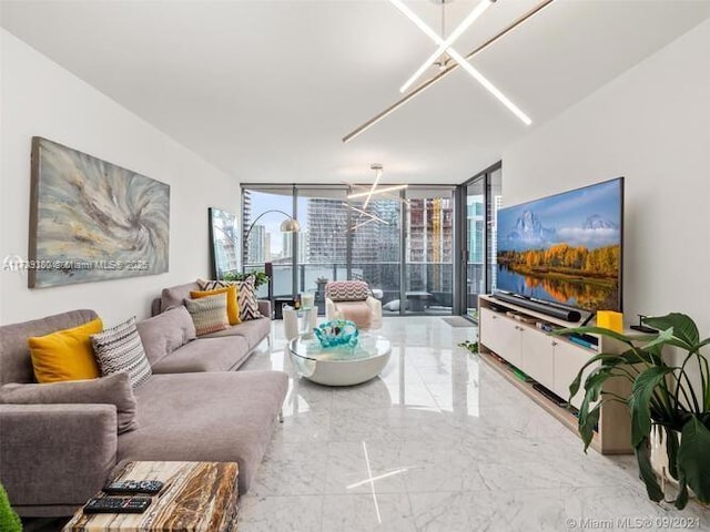 living room with expansive windows and a chandelier