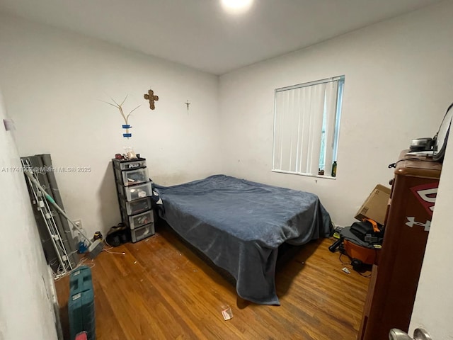 bedroom featuring hardwood / wood-style floors