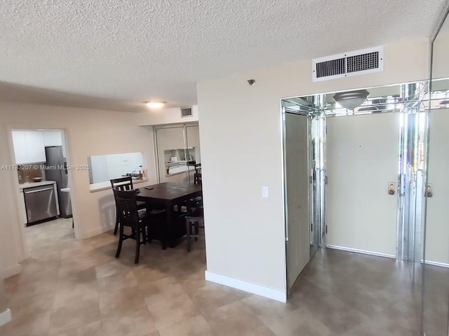 interior space with a textured ceiling