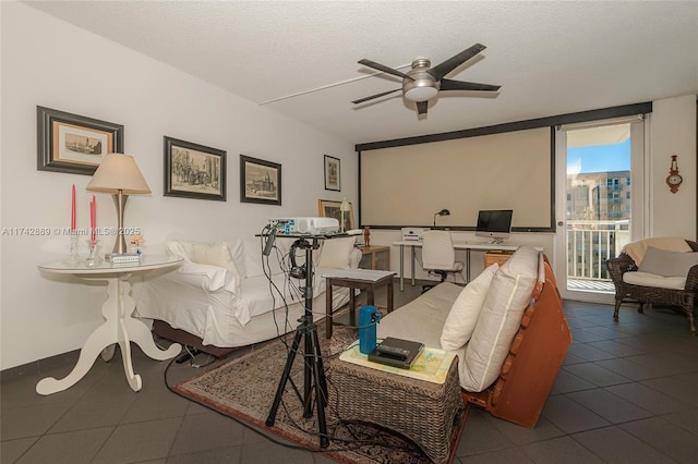 interior space with ceiling fan and a textured ceiling