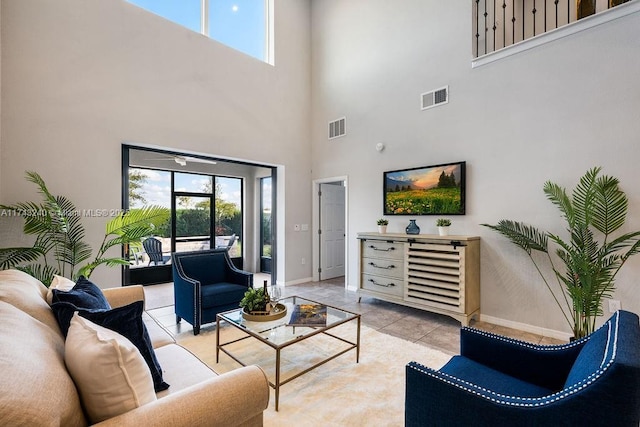 living room with plenty of natural light and light tile patterned floors