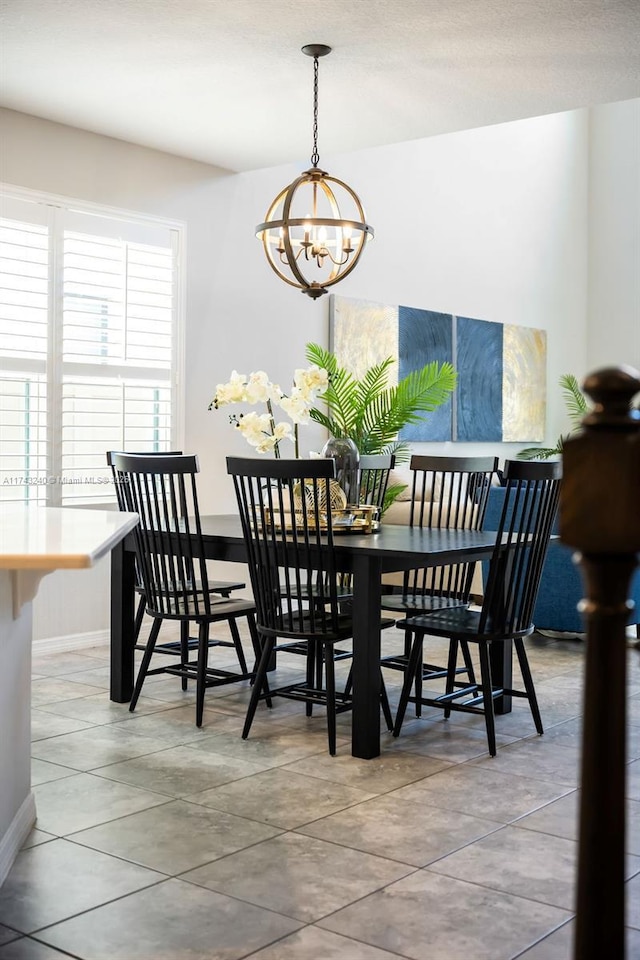 dining area featuring a notable chandelier