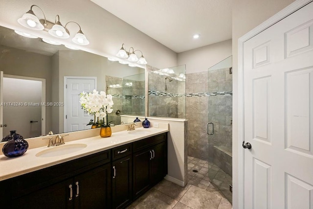 bathroom with vanity, tile patterned flooring, and a shower with door