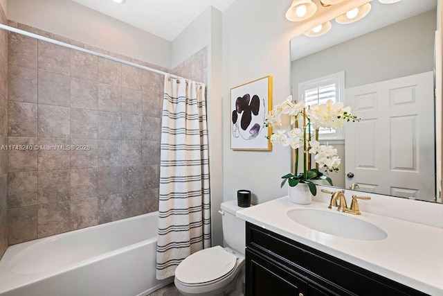 full bathroom with shower / tub combo with curtain, vanity, and toilet