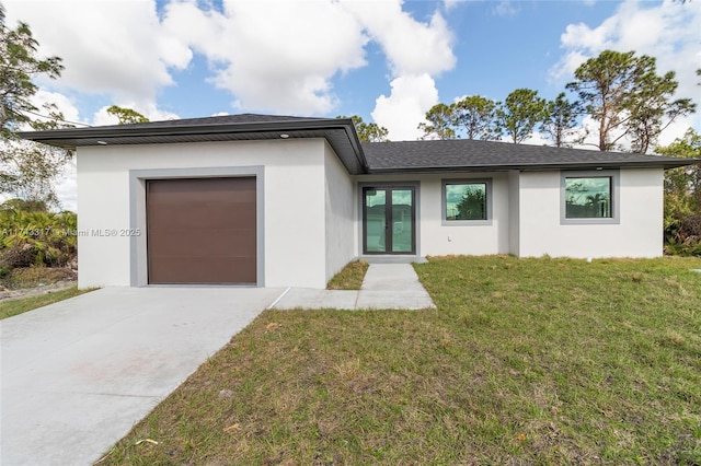 view of front facade featuring a garage and a front lawn