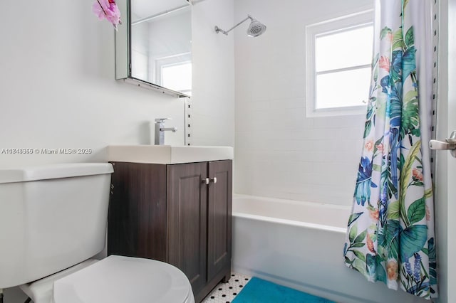 bathroom with toilet, shower / bathtub combination with curtain, and vanity