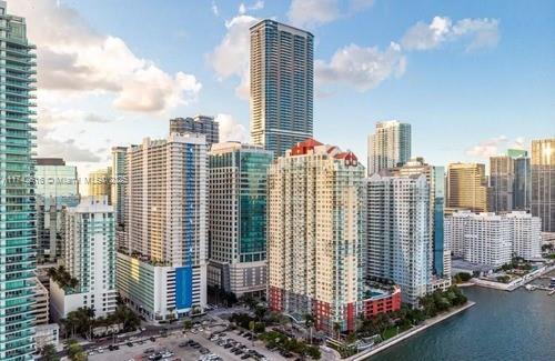 property's view of city with a water view