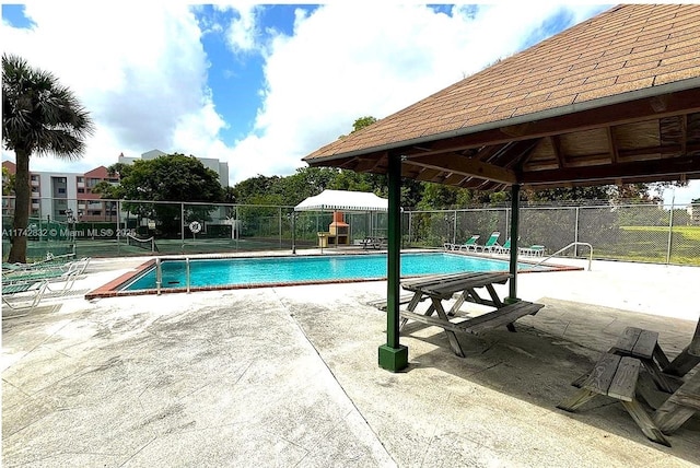 view of swimming pool featuring a gazebo and a patio