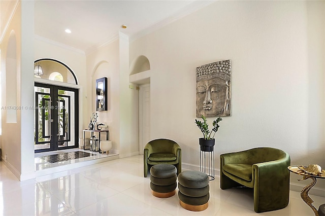 tiled entryway featuring ornamental molding and french doors