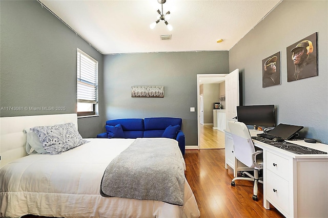 bedroom with hardwood / wood-style flooring