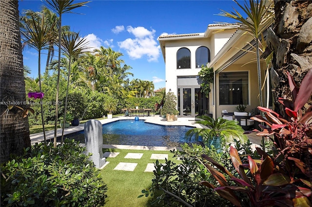 view of swimming pool with a patio area