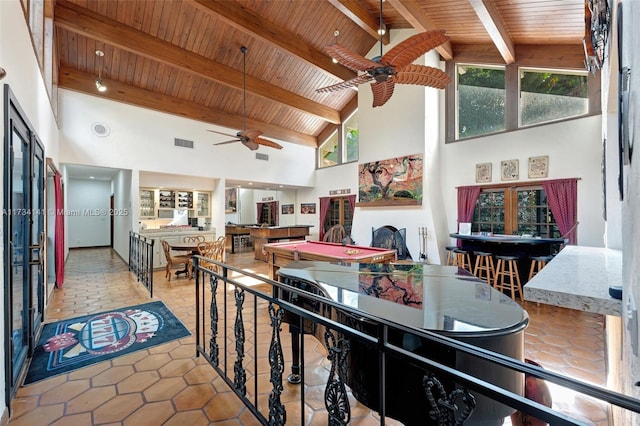 interior space with wood ceiling, beam ceiling, and high vaulted ceiling