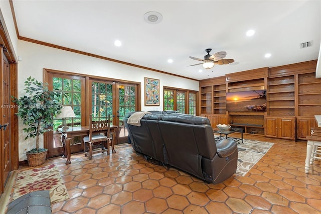 living room with crown molding and ceiling fan