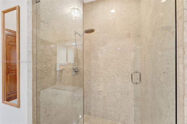 bathroom with a shower with shower door