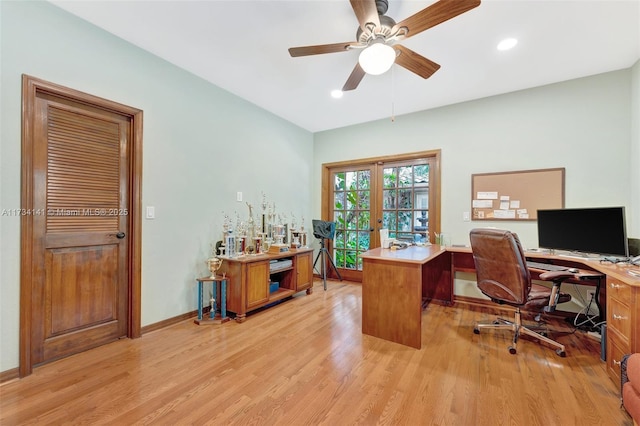 office space featuring ceiling fan, light hardwood / wood-style floors, and french doors