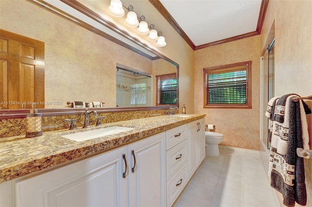 bathroom with crown molding, vanity, toilet, and a shower with door