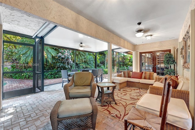 sunroom / solarium with ceiling fan