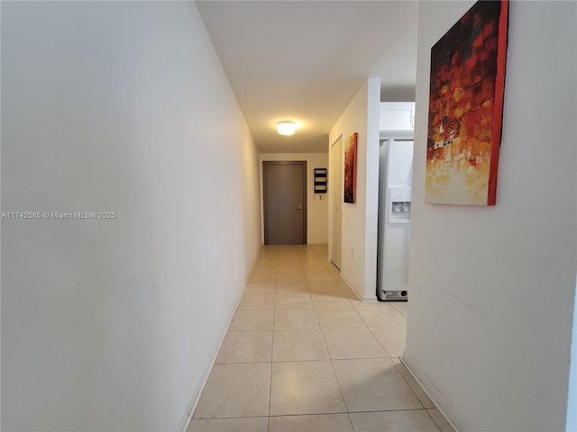 corridor featuring light tile patterned flooring