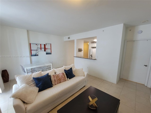 living room with light tile patterned floors